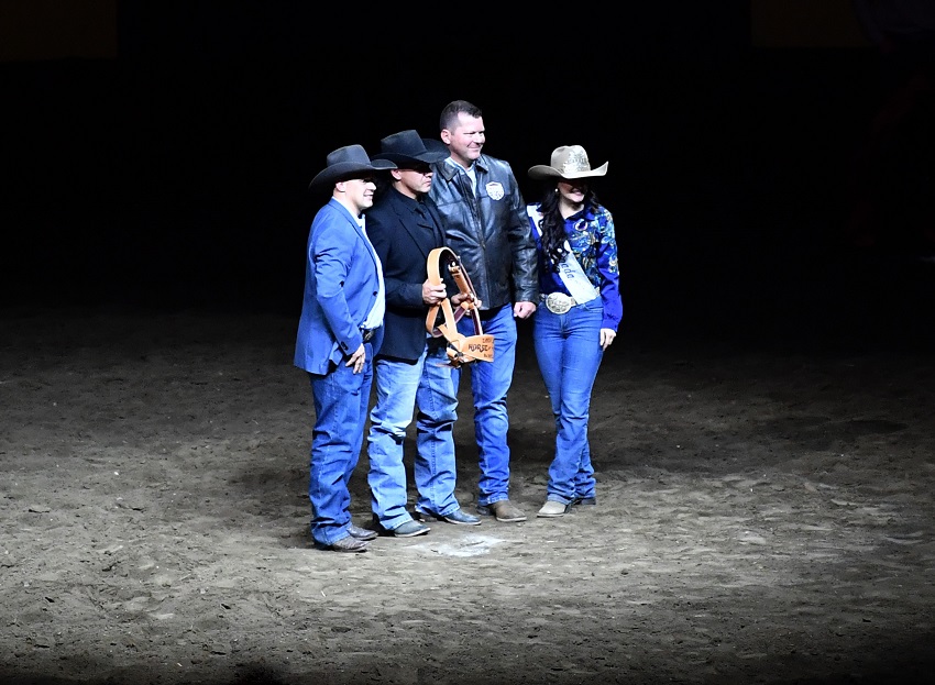 Minister of Agriculture and Irrigation RJ Sigurdson presents an award at the Canadian Finals Rodeo.