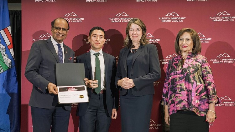 Lieutenant Governor Lakhani, Premier Smith and Minister Yaseen present award to recipient.