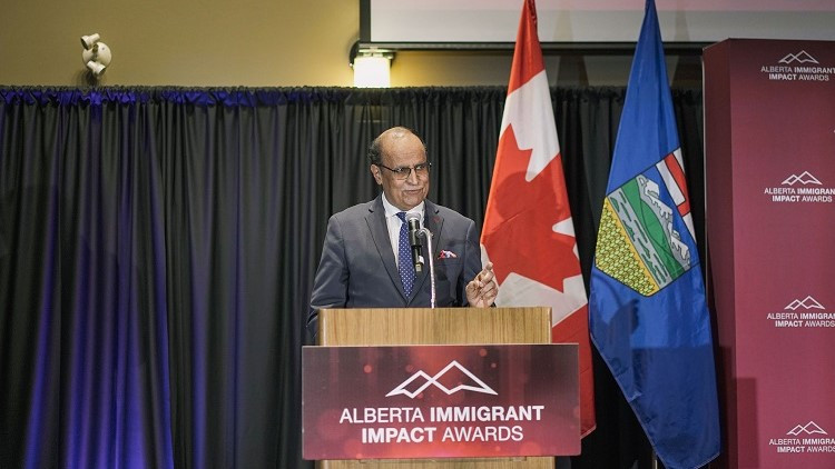 Minister Muhammad Yaseen speaks at the 2024 Alberta Immigrant Impact Awards ceremony.