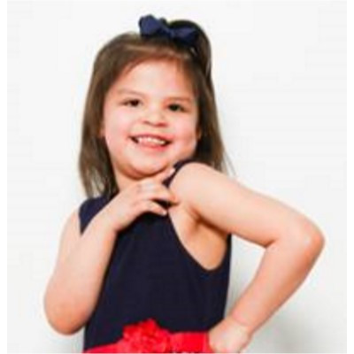 Adoption profile photo of Journey: Young girl with a half ponytail in a black and red dress