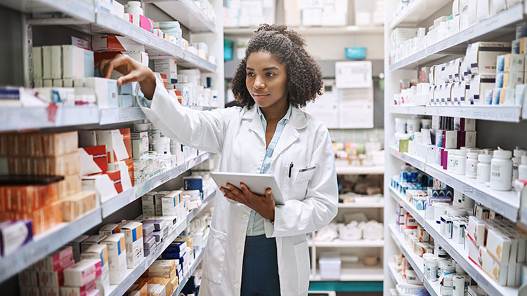 A young woman in a pharmacy storage area